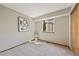 Simple bedroom with a window for natural light, neutral paint, and carpeted floors at 7345 W 97Th Pl, Broomfield, CO 80021