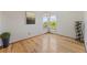 Cozy dining area featuring hardwood floors, natural light from windows, and space for a wine rack at 7345 W 97Th Pl, Broomfield, CO 80021