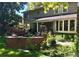 Spacious backyard with a covered patio, dining area, and beautiful landscaping, perfect for outdoor living at 2134 S Jackson St, Denver, CO 80210
