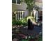 Manicured backyard featuring a charming fountain and patio area perfect for outdoor dining and relaxation at 2134 S Jackson St, Denver, CO 80210