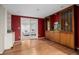 Finished basement with wood-look floors, built-in display case, and ample space for entertaining at 2134 S Jackson St, Denver, CO 80210
