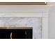 Close up of a fireplace with a marble mantle at 2134 S Jackson St, Denver, CO 80210