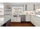 Kitchen with stainless steel appliances, farmhouse sink, and open shelving at 2134 S Jackson St, Denver, CO 80210