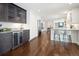 Bright kitchen features a wine cooler, dark wood accents and stainless appliances at 2134 S Jackson St, Denver, CO 80210