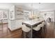 Bright, updated kitchen featuring a marble island and hardwood floors at 2134 S Jackson St, Denver, CO 80210