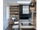 Living room featuring a stylish fireplace with built-in shelves and skylight above at 2134 S Jackson St, Denver, CO 80210