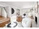 Living room with fireplace, hardwood flooring, and natural light at 2134 S Jackson St, Denver, CO 80210