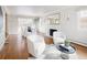 Spacious, bright living room and dining area with hardwood floors and a fireplace at 2134 S Jackson St, Denver, CO 80210