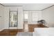 Open main bedroom with hardwood floors, contemporary furnishings, and large mirror at 2134 S Jackson St, Denver, CO 80210