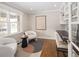 Bright home office with built-in shelving, hardwood floors, and large windows at 2134 S Jackson St, Denver, CO 80210