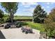 Beautiful backyard featuring patio, dining area, fire pit and landscaping and a mountain view at 9383 W Colorado Ave, Lakewood, CO 80232