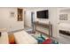 Finished basement area featuring a entertainment area with a TV and an open doorway to the bedroom at 9383 W Colorado Ave, Lakewood, CO 80232
