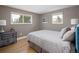 Cozy bedroom with hardwood floors, neutral walls, and two windows providing natural light at 9383 W Colorado Ave, Lakewood, CO 80232