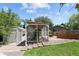 The backyard chicken coop is located near a small shed and garden bed at 9383 W Colorado Ave, Lakewood, CO 80232