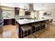 Spacious kitchen with a large island, stainless steel appliances, and dark wood cabinetry at 9383 W Colorado Ave, Lakewood, CO 80232