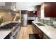 Well-equipped kitchen featuring stainless steel appliances, a large island, and plenty of counter space at 9383 W Colorado Ave, Lakewood, CO 80232