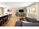 Bright living room with wood floors, neutral walls, a stylish rug, and a comfortable couch at 9383 W Colorado Ave, Lakewood, CO 80232