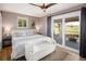 Spacious main bedroom with a ceiling fan, natural light, and access to a private balcony with great views at 9383 W Colorado Ave, Lakewood, CO 80232
