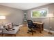 Bright and airy office space with hardwood floors, a large window, and a comfortable sitting area at 9383 W Colorado Ave, Lakewood, CO 80232