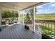 Outdoor porch with seating overlooking the landscaped backyard and neighborhood at 9383 W Colorado Ave, Lakewood, CO 80232
