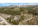 Picturesque mountain views highlight this aerial shot of the condos and surrounding landscape at 877 Airport Rd # 19, Breckenridge, CO 80424