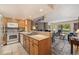 Open kitchen with wood cabinets and counters that flows into the living space at 877 Airport Rd # 19, Breckenridge, CO 80424