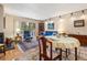 Comfortable living room featuring a fireplace and access to a patio with scenic views at 877 Airport Rd # 19, Breckenridge, CO 80424