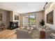 Comfortable living room with a fireplace and sliding glass door to outdoor scenery at 877 Airport Rd # 19, Breckenridge, CO 80424