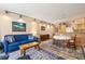 Living room leading to dining area and kitchen, filled with natural lighting at 877 Airport Rd # 19, Breckenridge, CO 80424