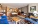 Open concept living space featuring a living room, dining space, and kitchen area at 877 Airport Rd # 19, Breckenridge, CO 80424