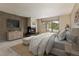 Serene bedroom with stone wall fireplace and scenic views from large windows at 877 Airport Rd # 19, Breckenridge, CO 80424
