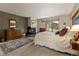 Relaxing bedroom featuring a stone wall fireplace and peaceful views from the window at 877 Airport Rd # 19, Breckenridge, CO 80424