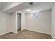 Basement bedroom with neutral walls, carpeted floors, and a window at 230 W 78Th Pl, Denver, CO 80221