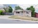Charming single-story home featuring a well-maintained lawn and a classic brick facade at 230 W 78Th Pl, Denver, CO 80221