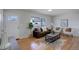 Inviting living room featuring stylish decor, hardwood floors, and natural light from a large window at 230 W 78Th Pl, Denver, CO 80221