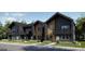 Modern townhome exteriors featuring a two-story design with beautiful architectural details at 8957 Whiteclover St, Littleton, CO 80125