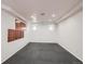 Finished basement area showcasing neutral walls, lighting fixtures, and a dedicated area for a home gym or recreation at 6534 Field St, Arvada, CO 80004