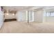 Spacious carpeted basement with neutral walls, recessed lighting, and an open layout offers versatile living space at 6534 Field St, Arvada, CO 80004