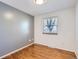 Neutral bedroom with window and hardwood floors offers lots of natural light at 6534 Field St, Arvada, CO 80004