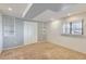 Bedroom featuring neutral walls, built-in shelving, carpeting, a closet, and natural light from a window with blinds at 6534 Field St, Arvada, CO 80004
