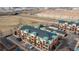 Aerial view of a residential community with buildings and convenient parking, and industrial nearby at 4100 Albion St # 205, Denver, CO 80216