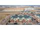 Community layout with well-placed buildings, parking, and a cityscape backdrop showcases an aerial view at 4100 Albion St # 205, Denver, CO 80216