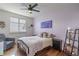Cozy bedroom with a ceiling fan and ample natural light at 4100 Albion St # 205, Denver, CO 80216