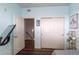 Bedroom with blue walls, storage shelves and sliding closet doors at 4100 Albion St # 205, Denver, CO 80216