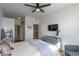 Cozy bedroom features a ceiling fan, TV, and a dresser with decorative accents at 4100 Albion St # 205, Denver, CO 80216