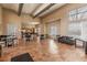 Beautifully designed common area with wood floors, comfortable seating, and a partial view of the kitchen at 4100 Albion St # 205, Denver, CO 80216