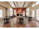 Spacious common area featuring hardwood floors, fireplace, and ample seating with views of the community at 4100 Albion St # 205, Denver, CO 80216