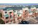 Lovely condos with unique awnings, multiple balconies, and convenient parking spaces at 4100 Albion St # 205, Denver, CO 80216