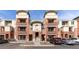 Attractive condo building featuring brick facade, balconies, and well-maintained landscaping in a community setting at 4100 Albion St # 205, Denver, CO 80216