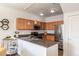 Modern kitchen with granite countertops and stainless steel appliances at 4100 Albion St # 205, Denver, CO 80216